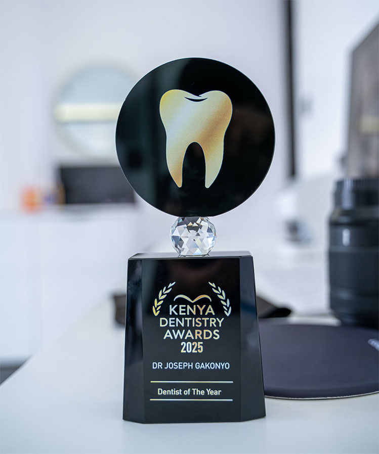 A trophy awarded to Dr. Joseph Gakonyo as Dentist of the Year 2025