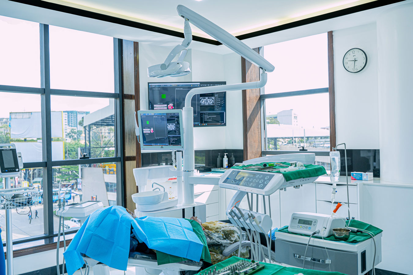 Summit dental care surgery room prepared with a patient seated on the dental chair before surgery.